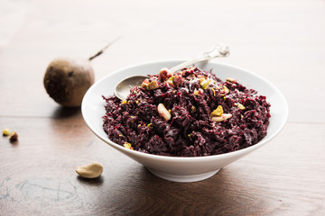 Beetroot Halwa garnished with Pistachio served in a bowl, selective focus