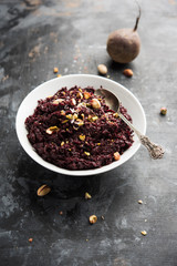 Beetroot Halwa garnished with Pistachio served in a bowl, selective focus