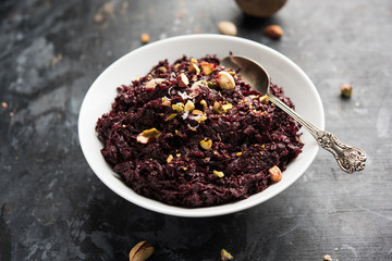 Beetroot Halwa garnished with Pistachio served in a bowl, selective focus