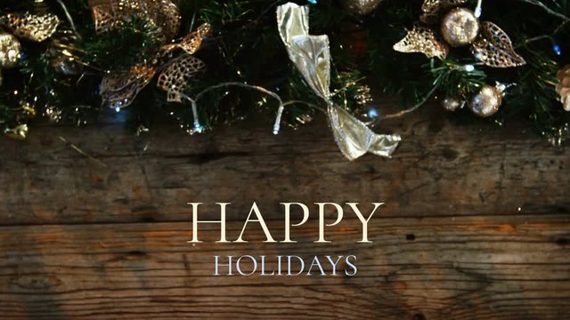 Happy holidays text and Christmas decoration