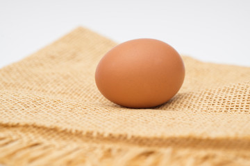 egg on sackcloth and white background texture