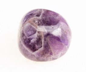 polished Amethyst gemstone on white