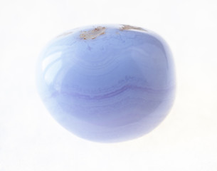 Fototapeta na wymiar polished blue lace agate (sapphirine) gem on white