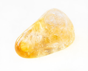 polished Citrine (yellow quartz) stone on white