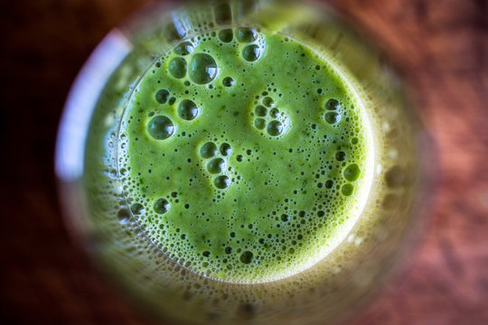 Close up of green smoothie with cucumber and cumin