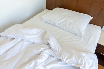 messy bedding sheets and pillow