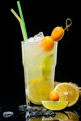 closeup alcoholic cocktail Piccante Thai with rum ginger decorated with kumquat