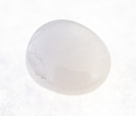 tumbled milky quartz stone on white