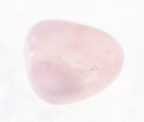 tumbled pink (rose) quartz gemstone on white