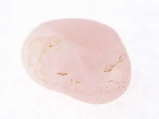 polished pink (rose) quartz gem on white