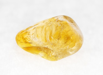 polished Citrine (yellow quartz) gem on white