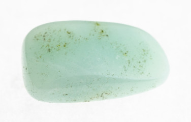 polished aquamarine (blue beryl) gemstone on white
