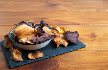 organic parsnip,beetroot and potato chips in a bowl