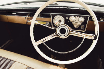 Vintage car steering wheel and dashboard