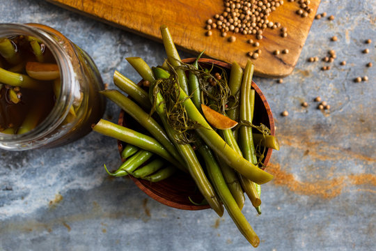 Overhead view of pickled green beans in bowl