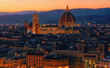 Fototapeta na wymiar Sunset view of Florence, Palazzo Vecchio and Florence Duomo, Italy. Architecture and landmark of Florence. Night cityscape of Florence