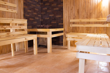 Fototapeta na wymiar Sauna is wooden. Body rest. Steam on the coals. health