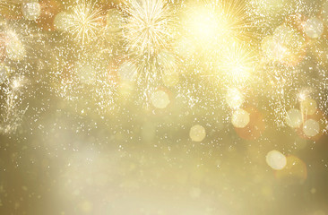 Abstract festive winter glittering bokeh background with fireworks and bokeh lights