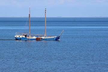 Afsluitdijk, Netherlands. Typical dutch boat sailing.