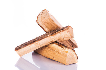 Stack of three cut logs with bark 