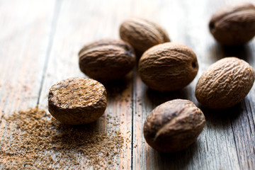 Close up of nutmeg on wooden table