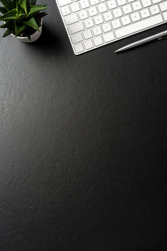 Business accessories on dark background with copy space