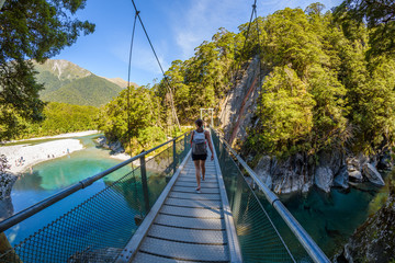 Crystal clear blue, green and turquoise cold freshwater of the Makarora river at the Blue Pools...
