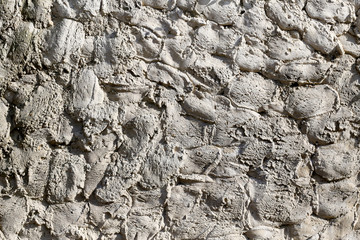 rough texture of a plaster gray wall.