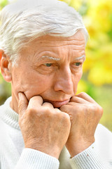 Portrait of a thoughtful elderly man solves