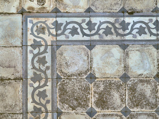 Detail Of Old Mosaic Ornamented Floor Tiles On A Rural Patio In Greece.