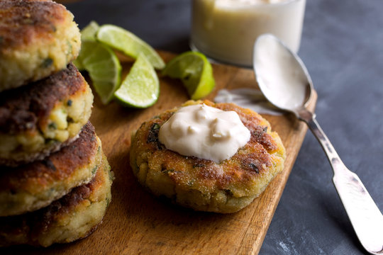 Close up of spicy fish cakes served on cutting board