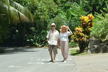 Portrait of elderly couple rest at tropical beach