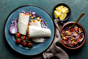 Burritos wraps with chicken meat and vegetables, traditional Mexican cuisine, fastfood © Sunny Forest