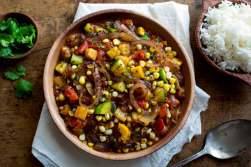 Close up of stir fried vegetables served with rice on table
