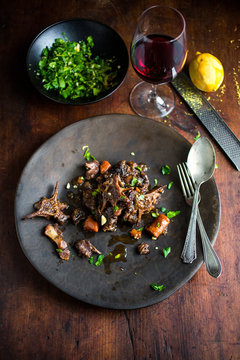 Oxtail stew served on plate on wooden table