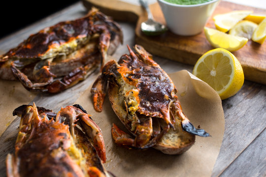 Close up of soft shell crab toasts served on wooden table