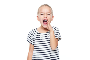 Cute little girl in stripped T-shirt shouting. Speech therapy concept over white background. - obrazy, fototapety, plakaty