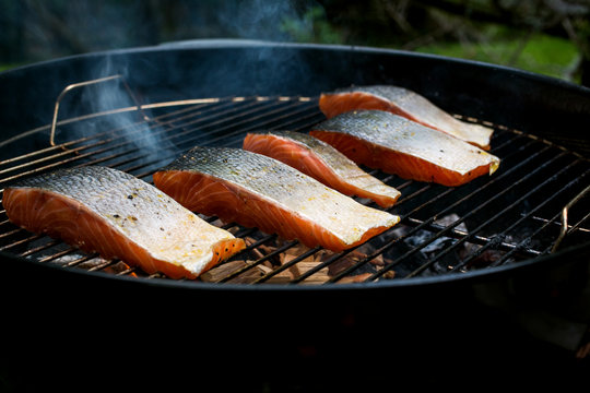 Close up of salmon grilling on barbecue grill