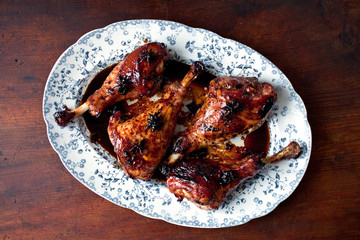 Close up of chicken drumsticks served on plate