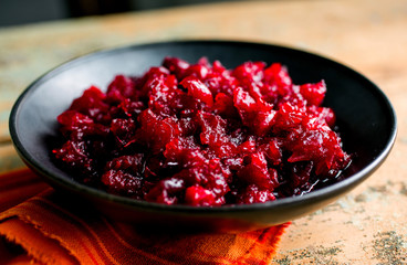 Close up of red pepper and cranberry relish served in bowl 
