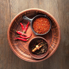 Selection of spices pepper. Food background on black wood table. Top view copy space