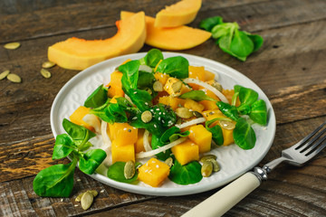green salad and baked pumpkin.