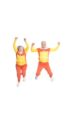 Active senior couple exercising isolated on white background
