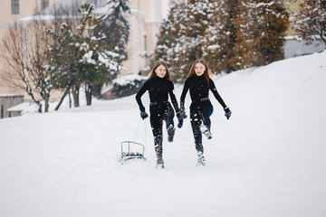 Fototapeta na wymiar Girls in a winter park