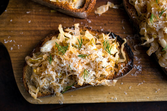 Close up of cabbage bruschetta served on cutting board