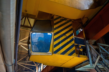 Yellow cab gantry crane in the production shop forging plant. Crane Beam in stock