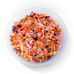 Russian salad Vinaigrette in a plate on a white background