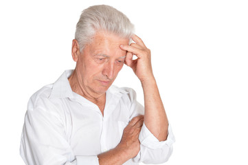 Portrait of thinking senior man on white background