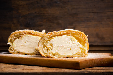 Vanilla cream roll pastry on a board