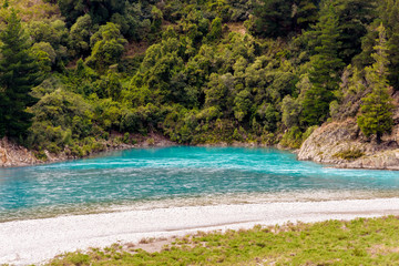 Plakat Crystal clear turquoise glacier fresh water flowing at the bend of Rakaia River at Rakaia Gorge Valley, Canterbury, New Zealand